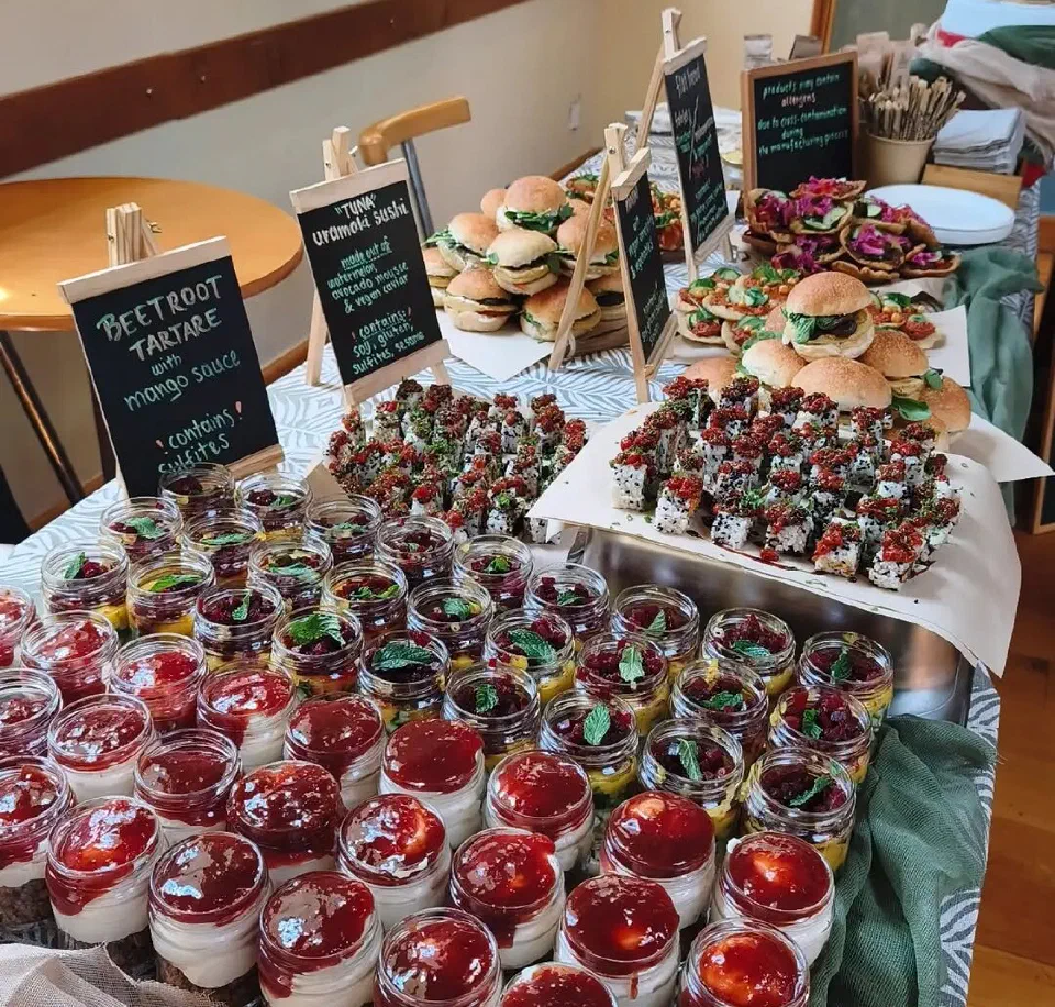 Catering buffet with sliders, beetroot tartare and cheesecake jars
