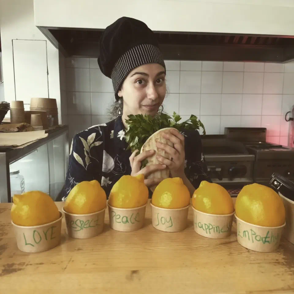 In the Veganato kitchen, with a wrap and pots of lemons